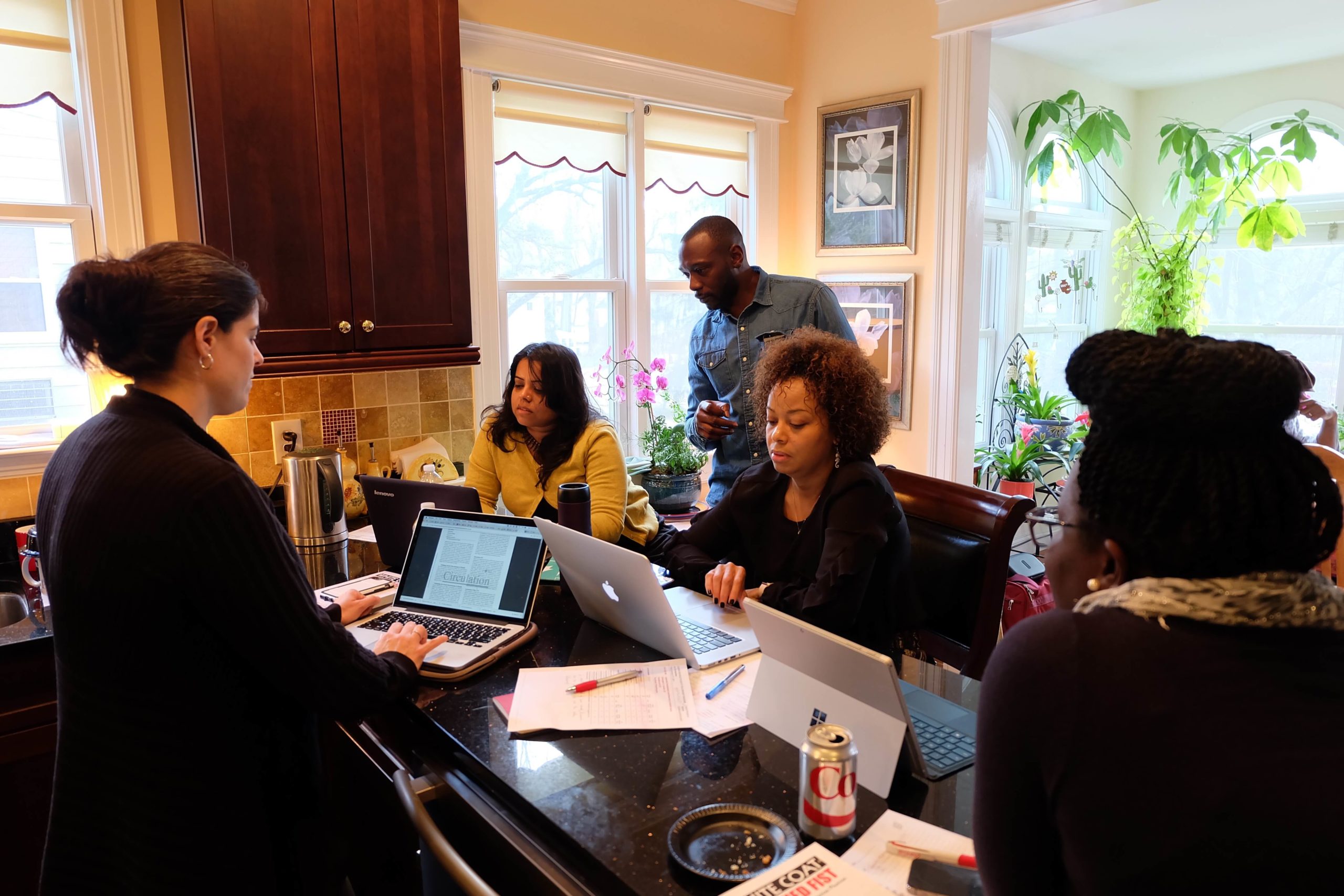 people in front of a computer working