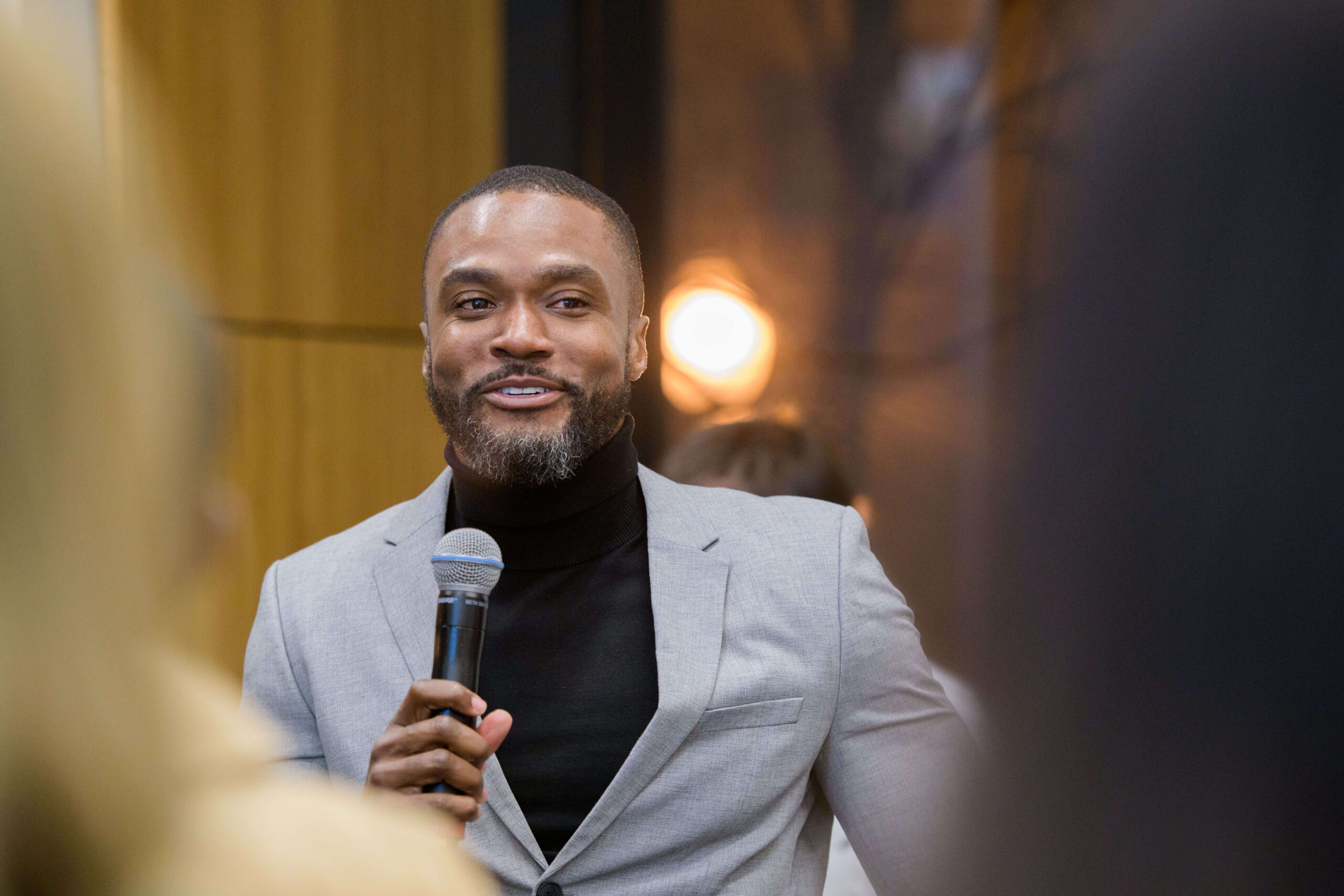 man speaking into microphone