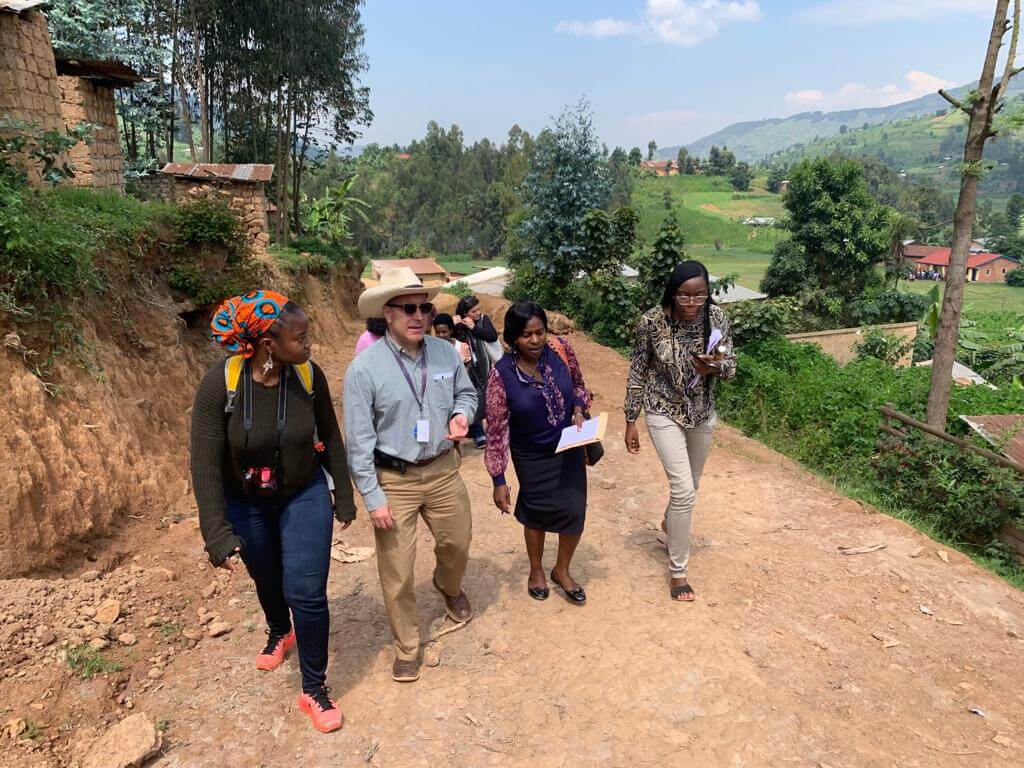 Adrian Billings, Artanesha Jackson and others walking up the road in Rwanda