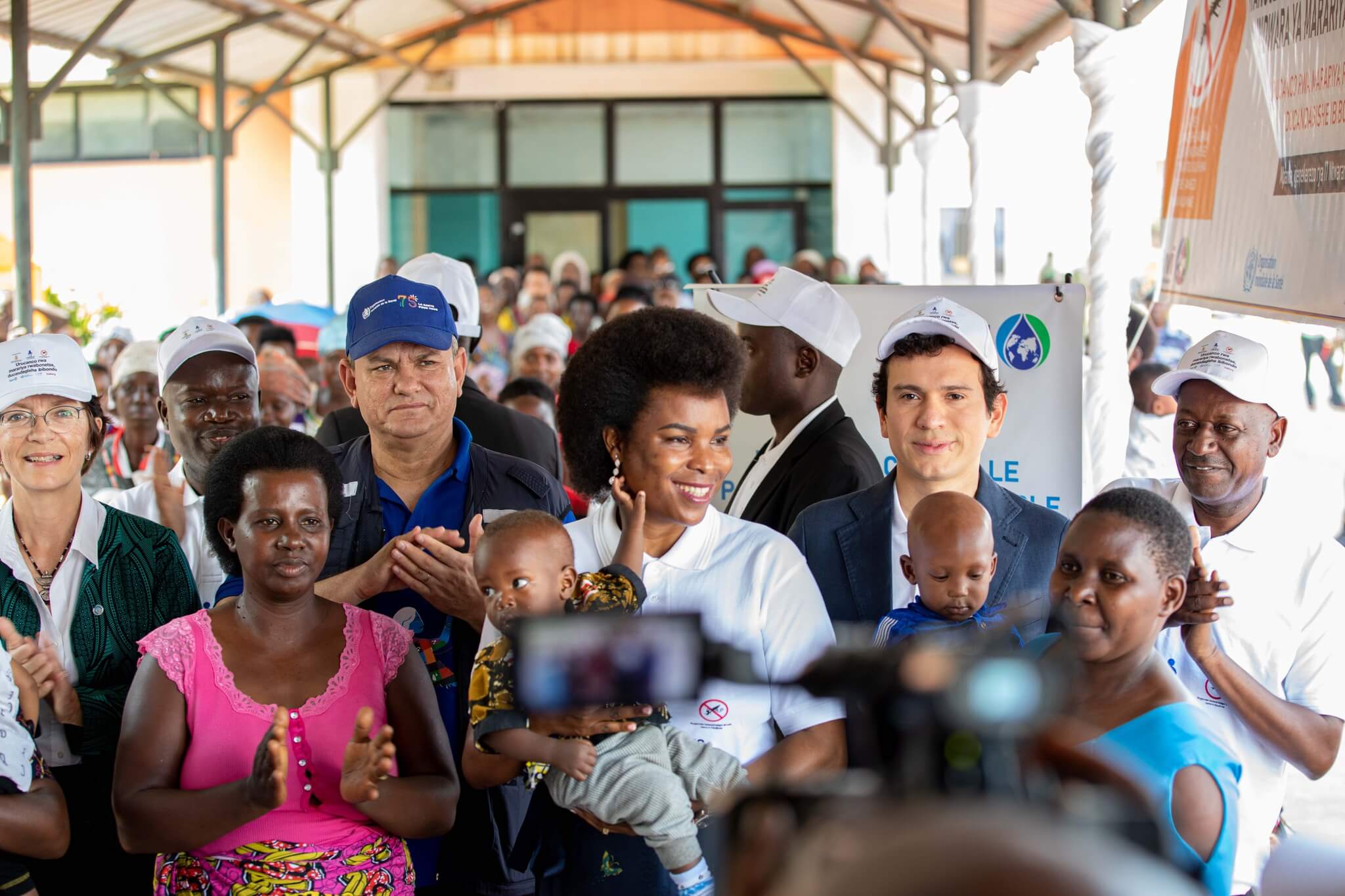 Group of people at a press event in Burundi.