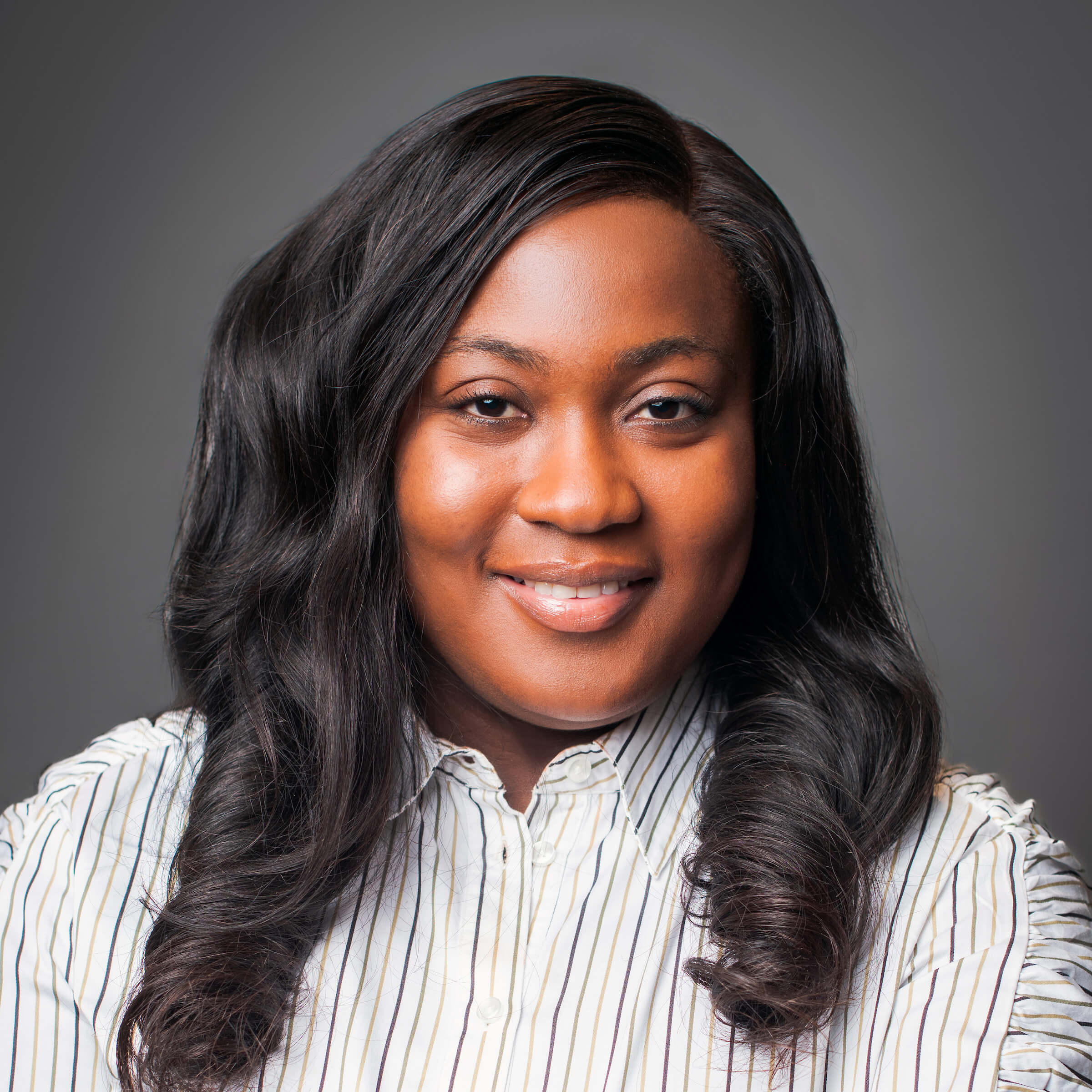 Black woman posing for a headshot.
