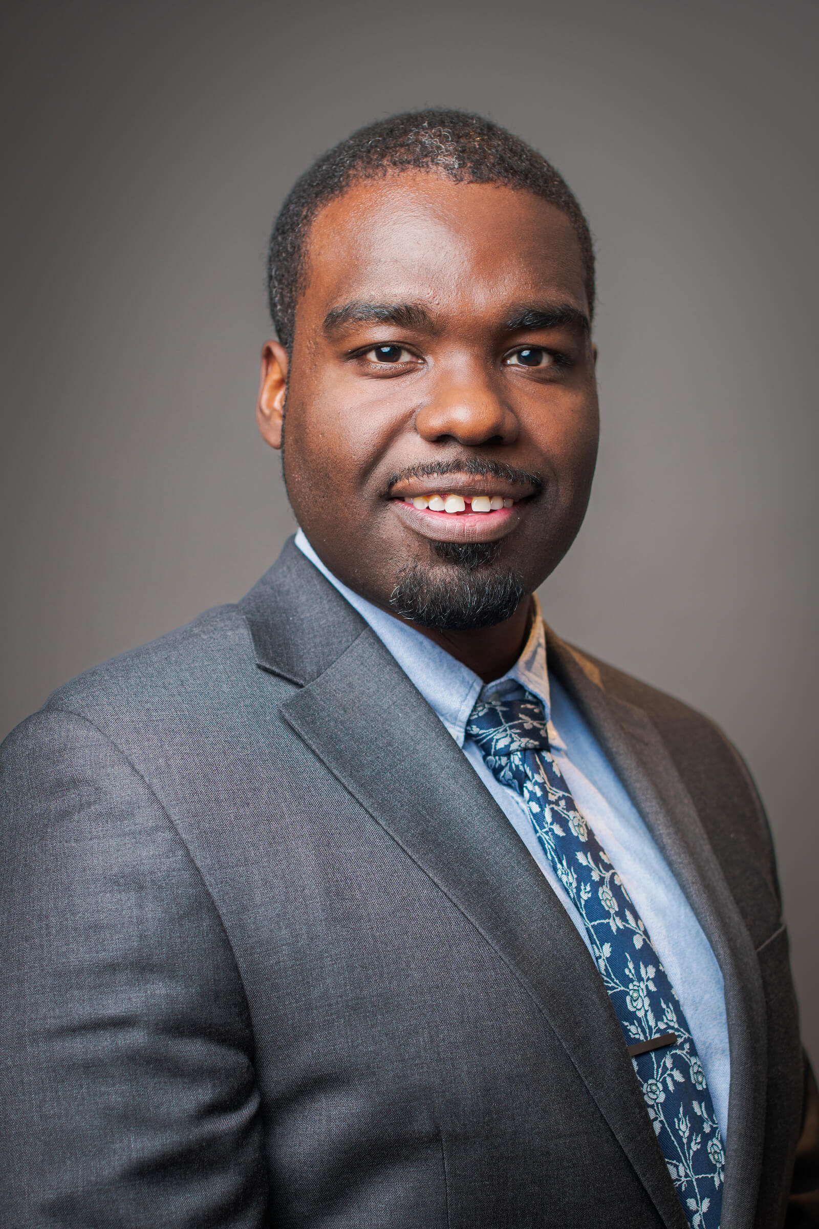 Professional headshot of a man.