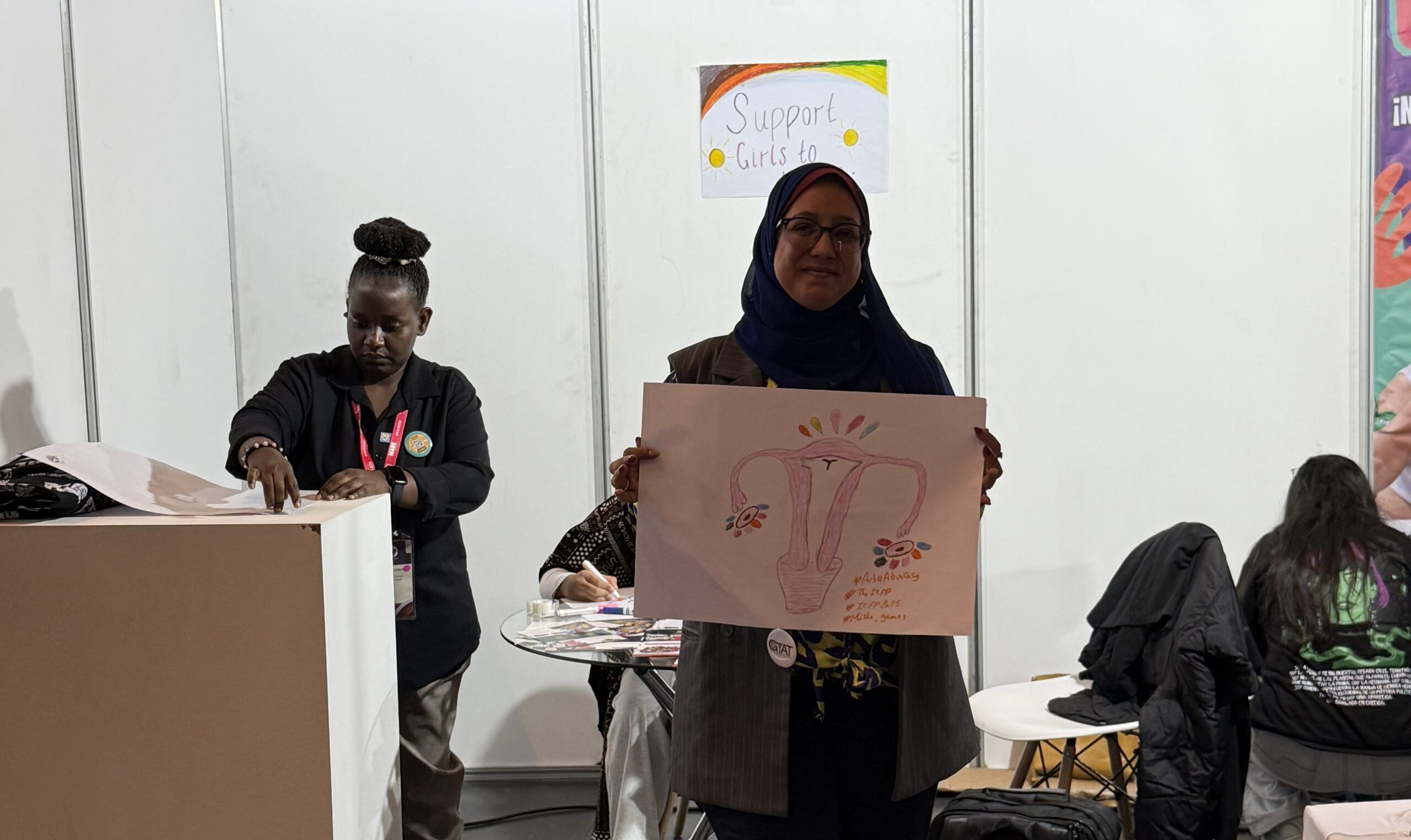 woman standing with a poster