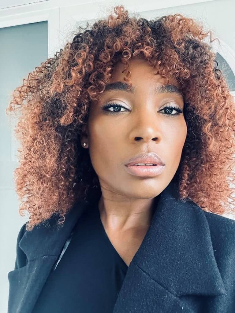 Woman posing for a headshot.